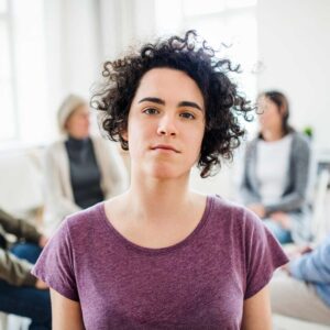 A portrait of young depressed woman during group t YKGB2PX.jpg